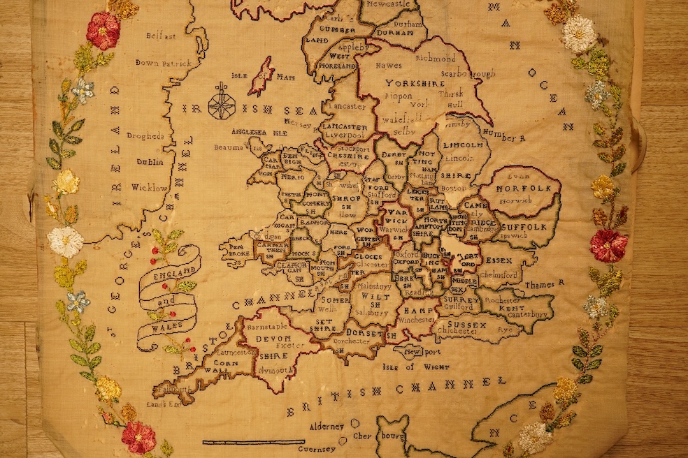 An 18th century embroidered map of England, unframed (distressed), 59cm high